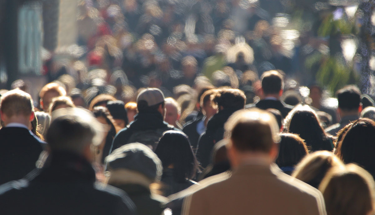 Blurred faceless crowd
