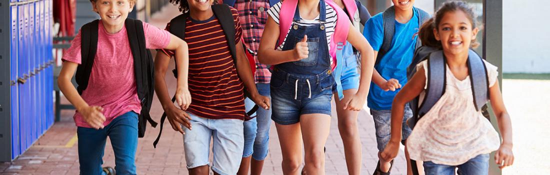 Group of smiling children who are running